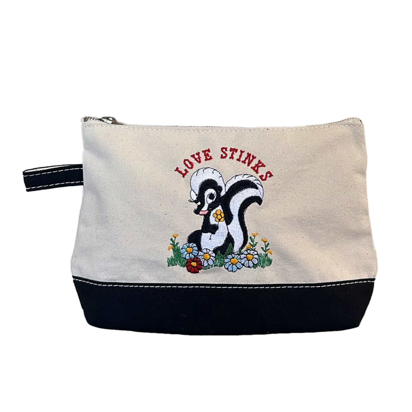 Canvas pouch with skunk illustration and 'Love Stinks' text on a white background