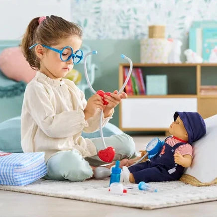Child playing with toys on a rug in a room with shelves and decor.