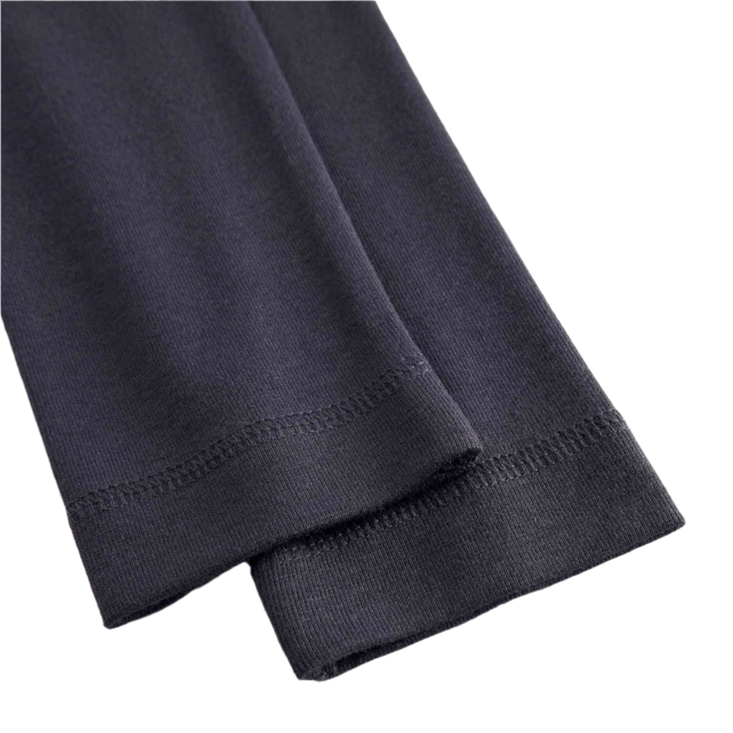 Close-up of dark gray pants on a white background