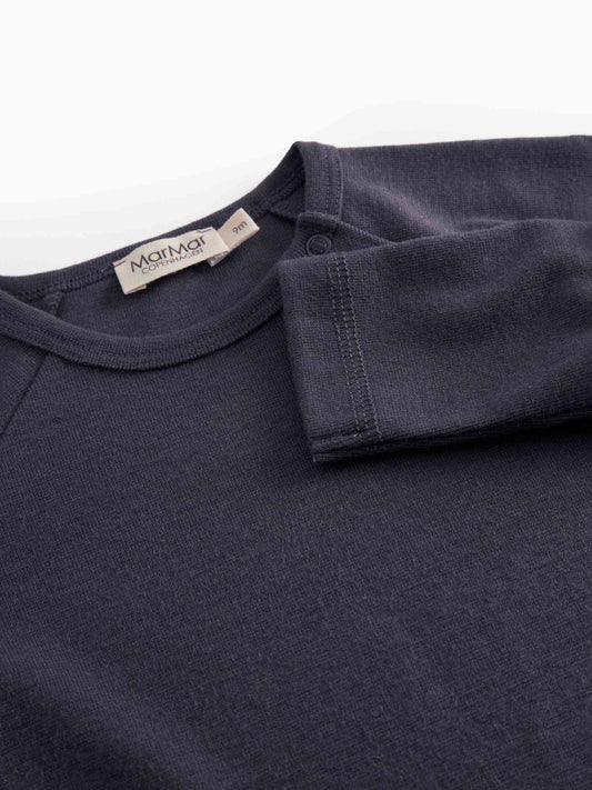 Navy blue shirt with a visible brand label on a white background