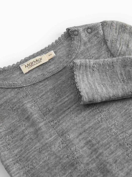 Gray textured fabric with a brand label on a white background