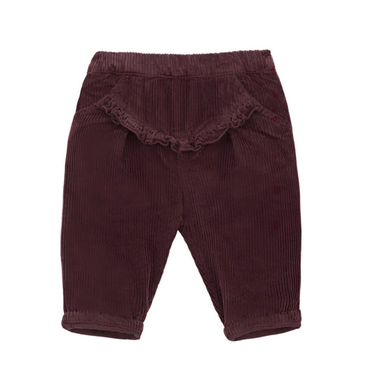 Maroon corduroy baby pants with ruffled trim on a white background