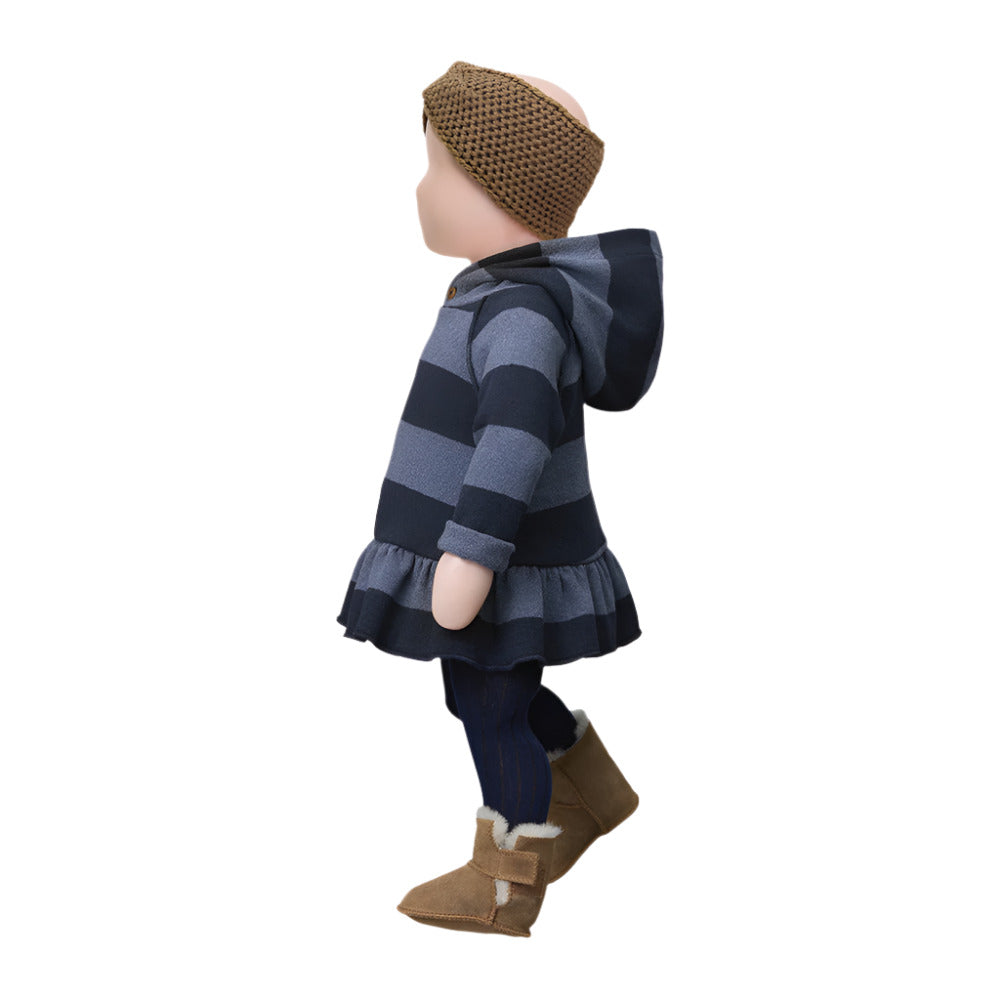 Doll wearing a striped dress, headband, and boots on a white background