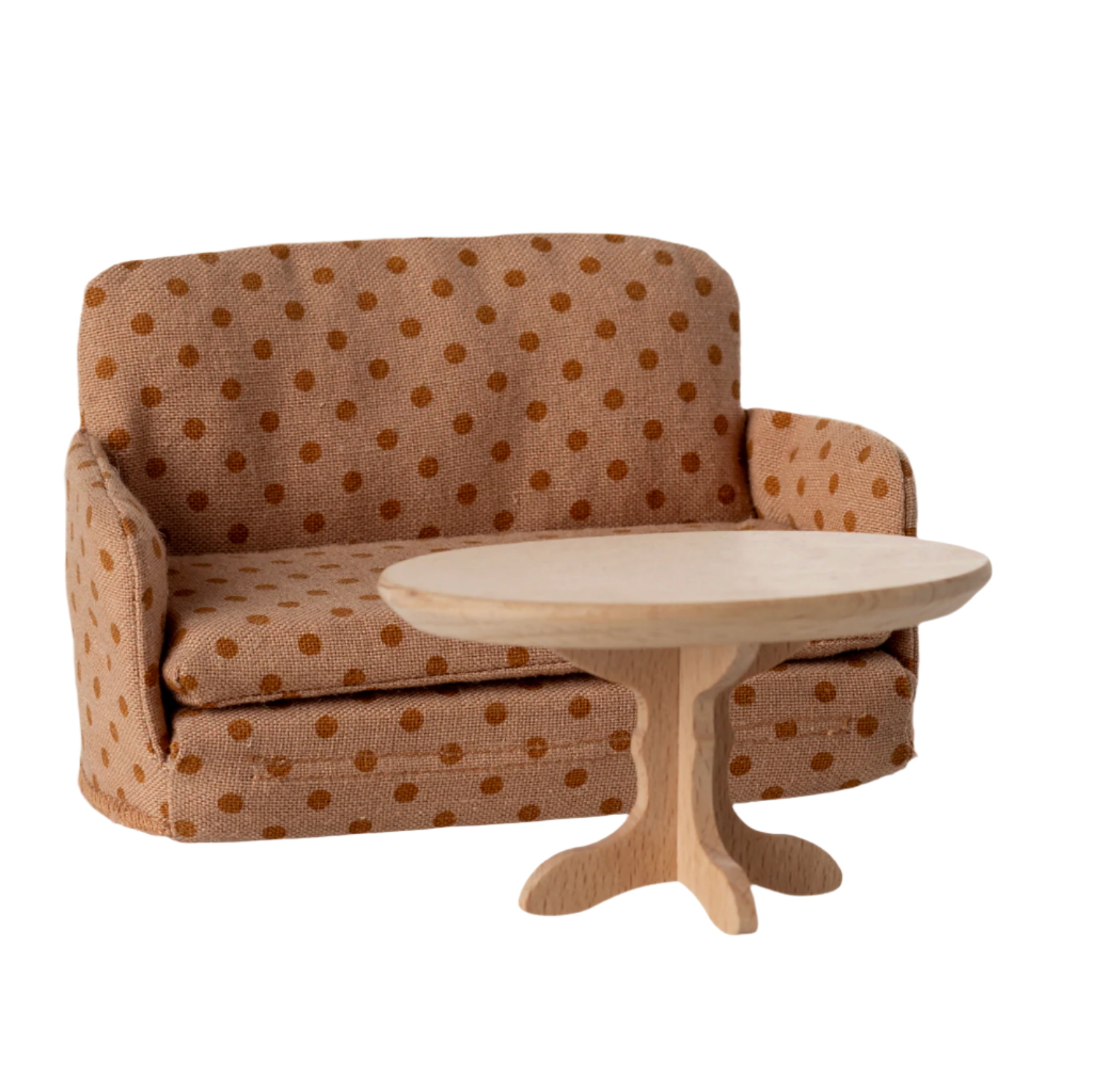 Brown polka dot sofa with a matching round table on a light beige background