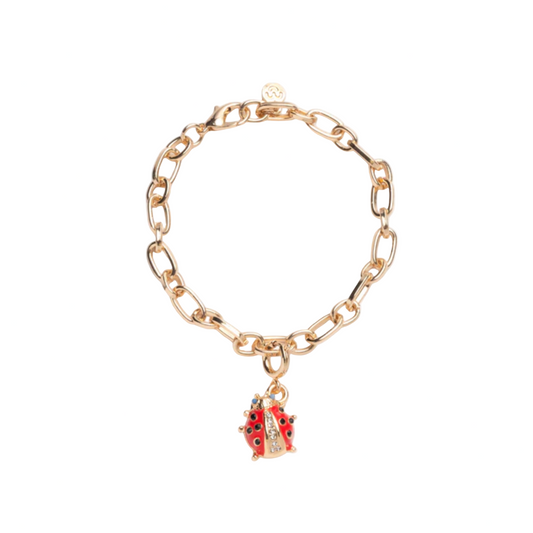 Gold chain bracelet with a ladybug charm on a white background