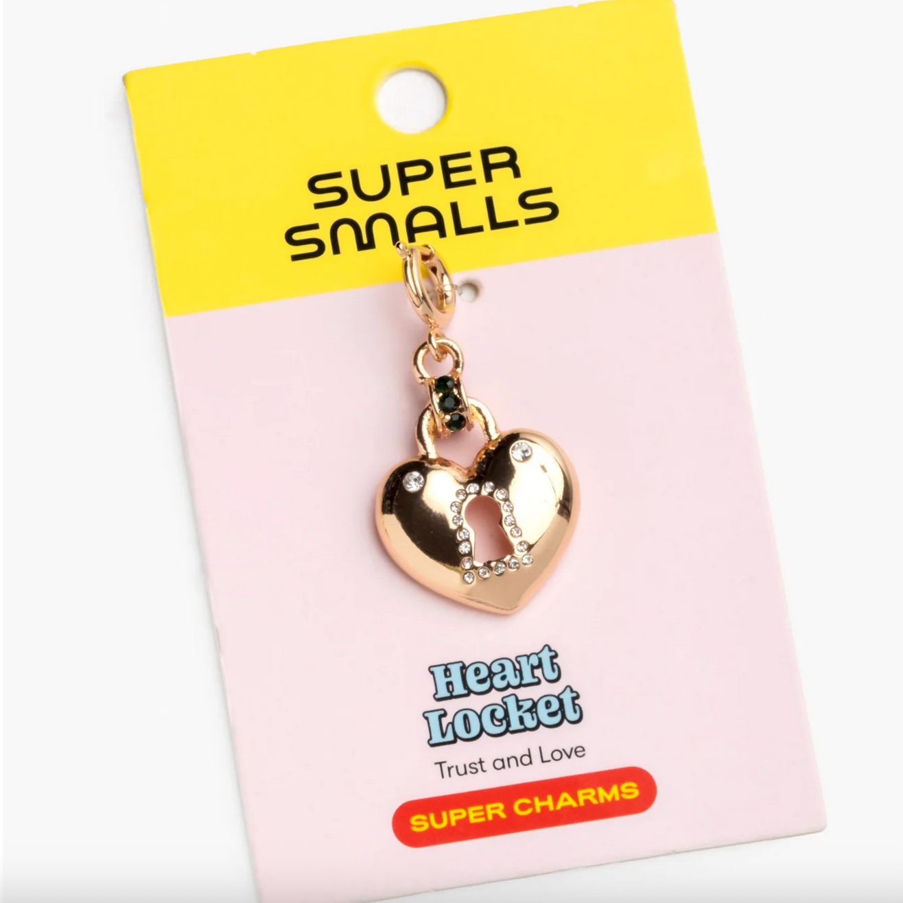 Gold heart locket charm on a 'Super Smalls' branded card with a yellow top section.