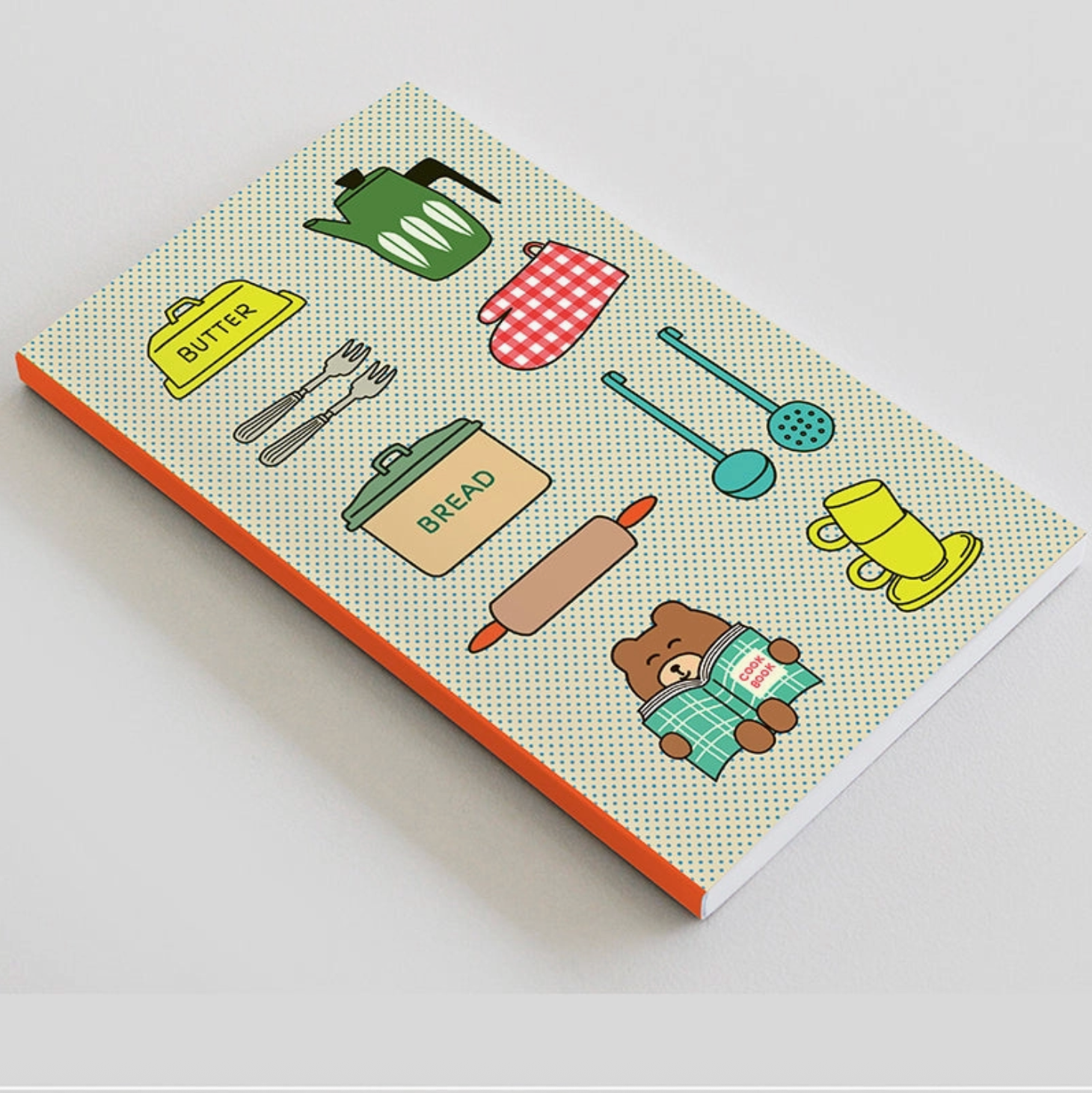 Notebook with cartoon illustrations of kitchen items and a bear on a light gray background