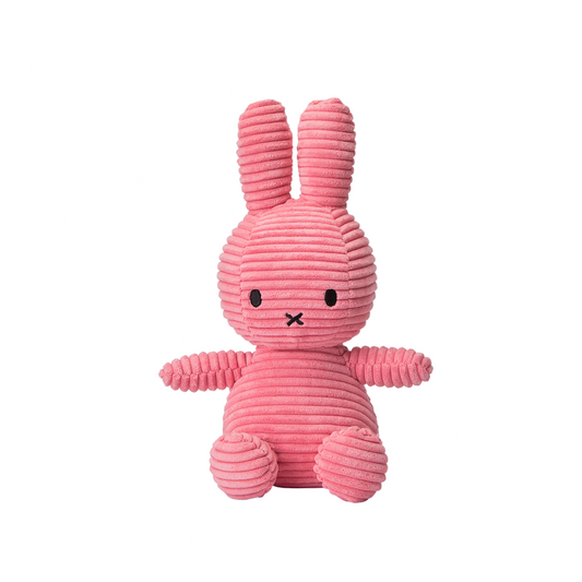 Pink ribbed bunny toy on a white background