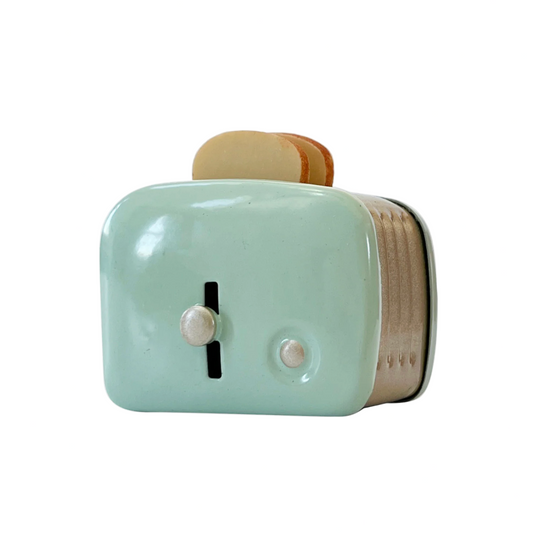 Small green toaster with wooden accents on a white background
