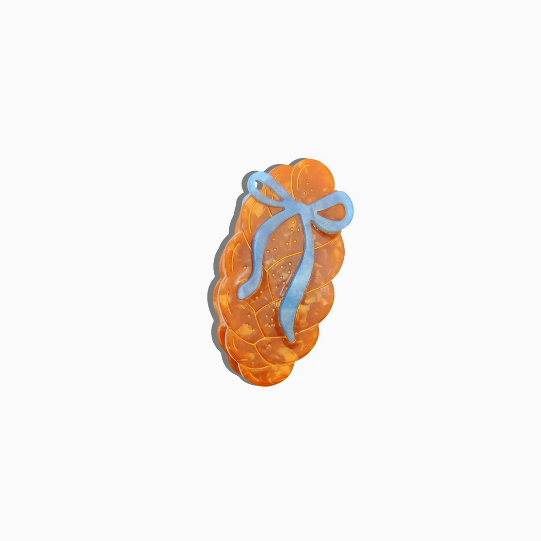 Decorative cookie with a blue ribbon on a white background