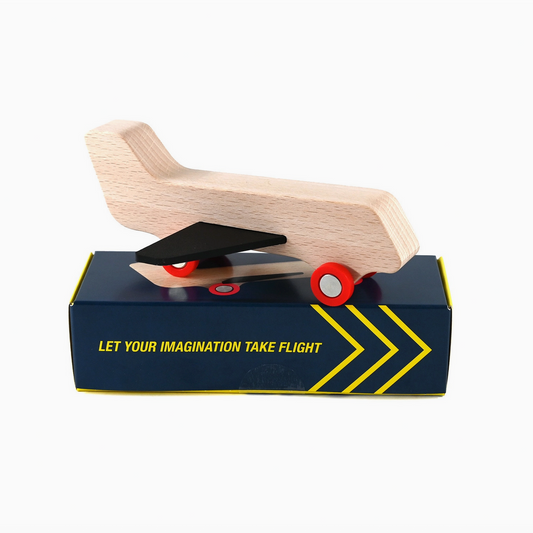 Wooden toy slide on a black box with text 'Let your imagination take flight' on a white background
