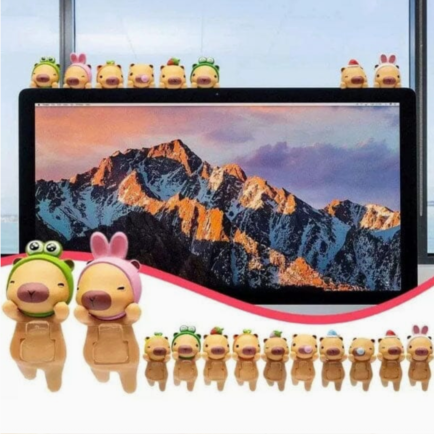 Small animal figurines arranged around a computer screen displaying a mountain landscape.