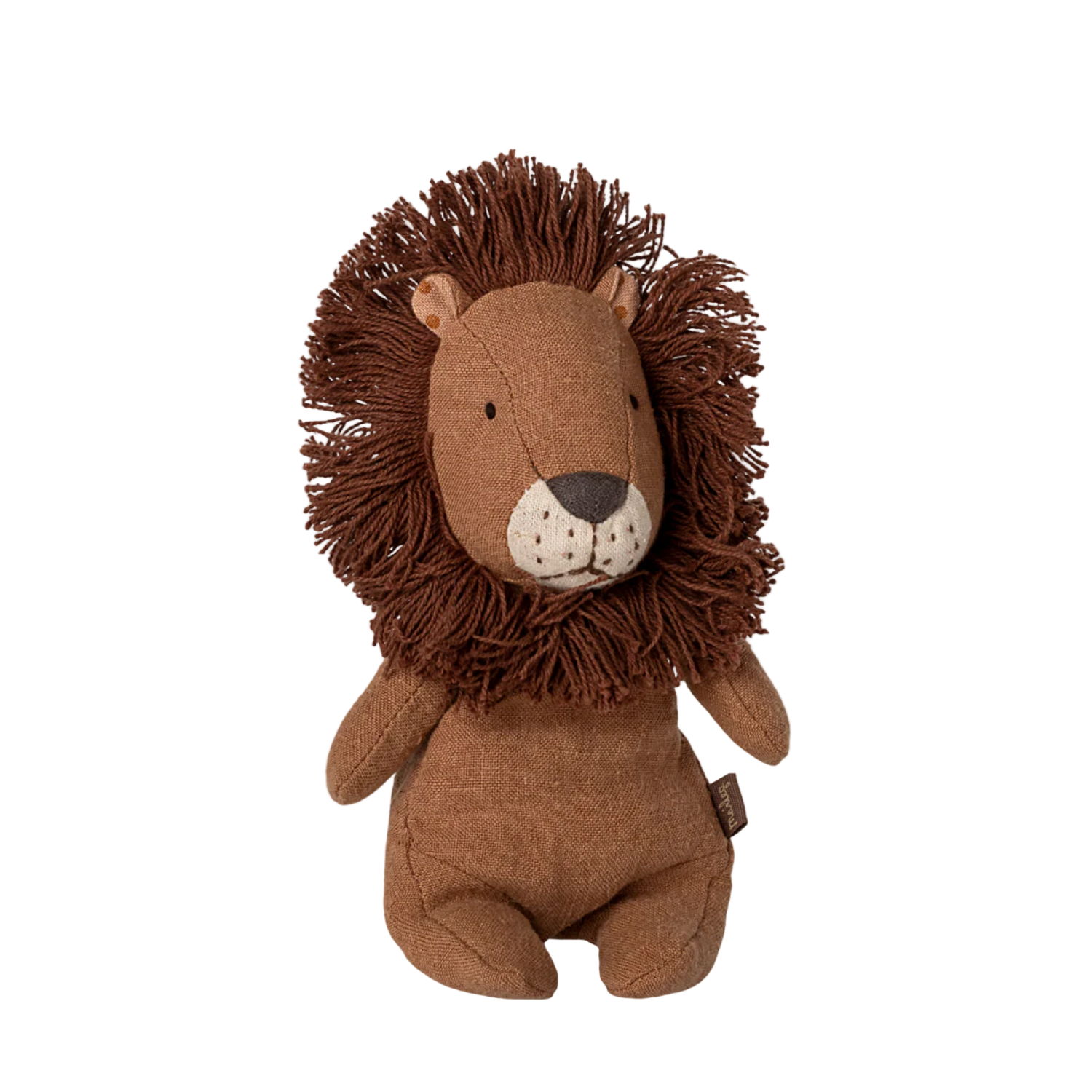 Stuffed lion toy on a beige background